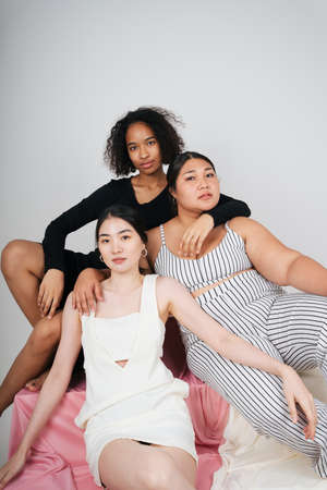 Fashion portrait group of three diverse women with asian and african.の写真素材