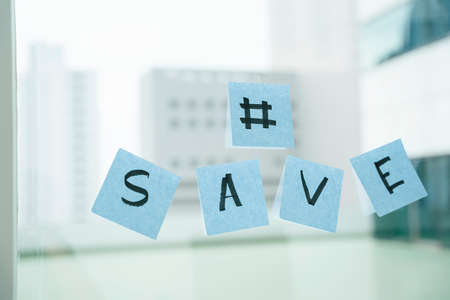 Message on the glass wall written with SAVE messages.の写真素材
