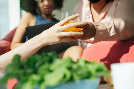 Healthy people eating healthy food with vegetable salad and orange juice.の写真素材