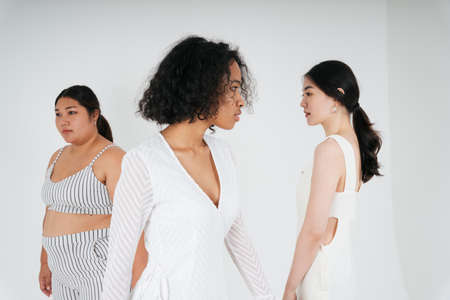 Portrait of diversity multi ethnicity of asian and african women over white background.の写真素材