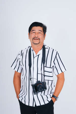 Adult asian man in white shirt as photograher with camera isolate on white background.