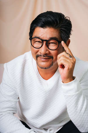 Fashion portrait of cool old elderly senior man wearing eyeglasses.