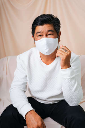 Fashion portrait of cool old elderly senior man wearing mask.