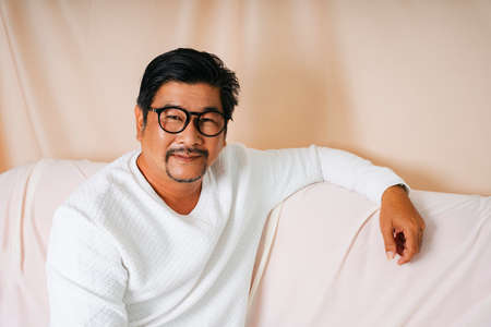 Fashion portrait of cool old elderly senior man wearing eyeglasses.の写真素材