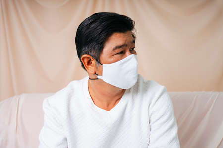 Fashion portrait of cool old elderly senior man wearing mask.の写真素材