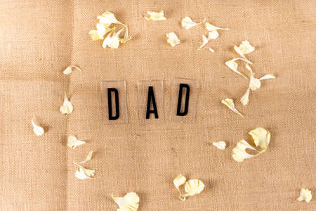 Top view - Dad word with flower in circle shape.の写真素材