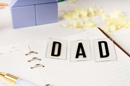 Dad words on vintage book for Father day celebration.の写真素材