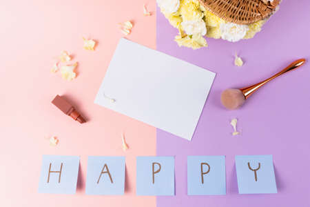 Top view - Paper for mock up with happy letter and cosmetic accessories.の写真素材