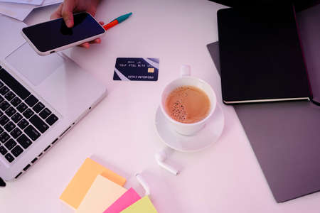Top view - Businesswoman working desk with lot of stuff.