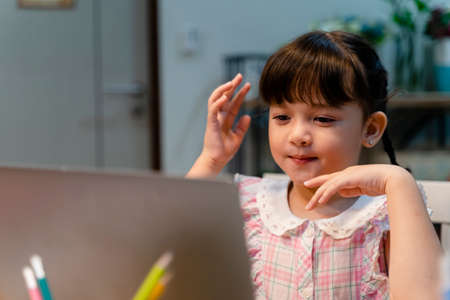 Child study from home with digital laptop for online course.の写真素材