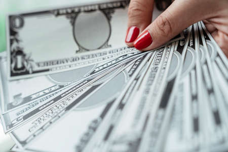 Bunch of banknote counting money cash. Woman hand holding cash.の写真素材