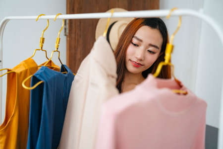 Beautiful young asian woman buying clothes in shopping mall.の写真素材