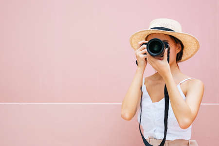Young traveler asian woman with digital camera.の写真素材