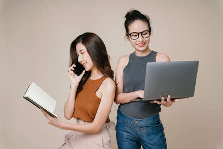 Portrait of two asian business women in casual shirt working together.の写真素材