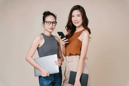 Portrait of two asian business women in casual shirt standing together.の写真素材