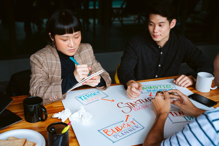 Young business people working on new startup project together in meeting room.の写真素材