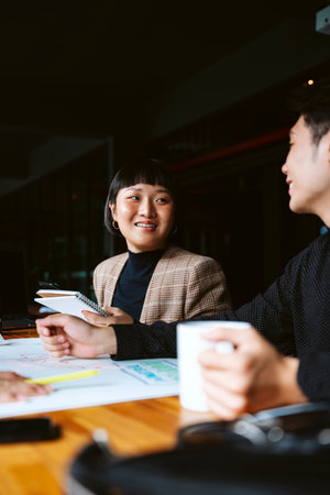 Young businesswoman working with partner in meeting room.の写真素材