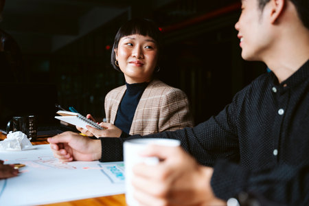 Young businesswoman working with partner in meeting room.の写真素材