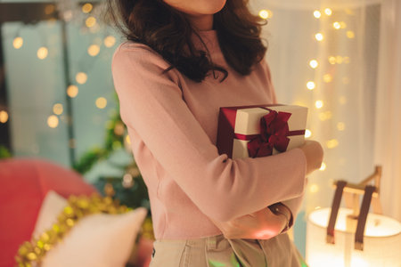 Beauty young asian woman black hair holding christmas gift box in party.の写真素材