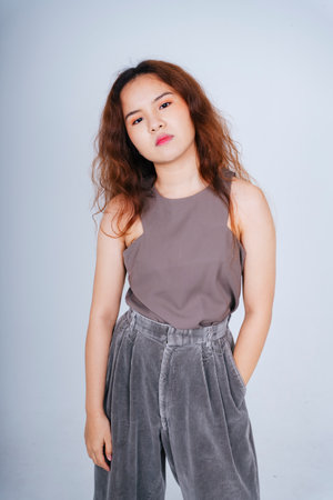 Fashion portrait of young asian curly hair woman isolate on white background.の写真素材