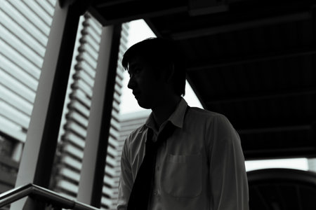 Messy businessman in Black and White walking in the city.の写真素材