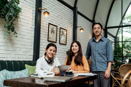 Portrait of young asian business people working together in modern offce.の写真素材