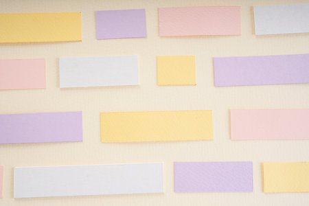 Pastel purple pink yellow mock up sticky note over white background. Copy space.の写真素材