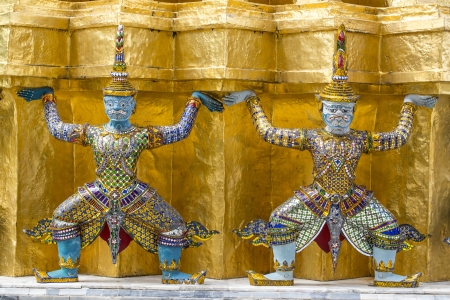 Giant guardians on base of pagoda, Thailandの写真素材