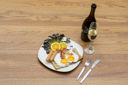 Breakfast with bacon, fried egg and Champangeの写真素材