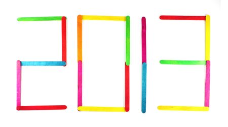 2013 wood ice-cream stick on a white backgroundの写真素材