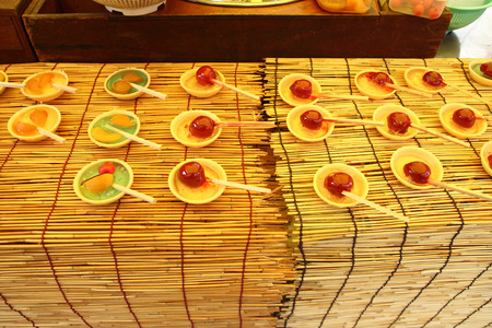 japanese candy apple coated with sugar glazeの写真素材