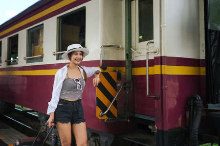 The young Asian women starting her trip and travel by train, Traveling along Asia, Chiangmai,...