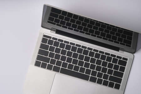Top view with notebook computer on white background, Mock up.