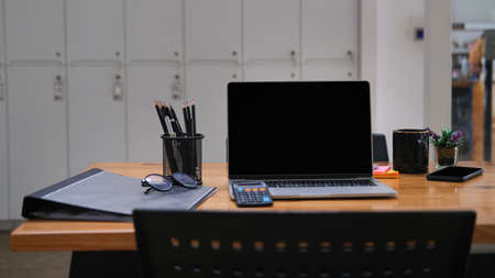 Mock up with laptop placed on wooden table, Office desk concept.の写真素材