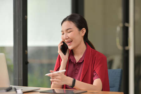 Portrait with woman who talking with smartphone.の写真素材