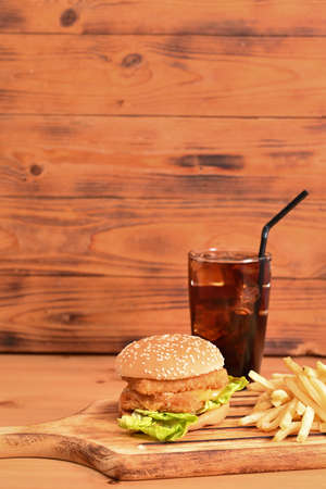 burger and French with drink, fast food on the wooden table.の写真素材