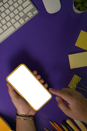 Top view of hands using smartphone, screen of smartphone.の写真素材