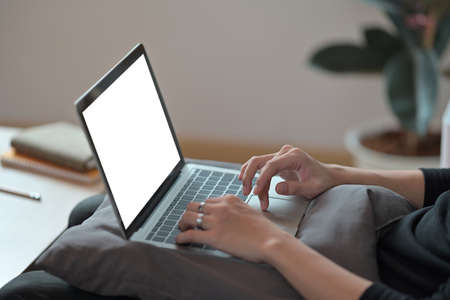Closed up with male hands typing on laptop keyboard, business and financial concept.の写真素材