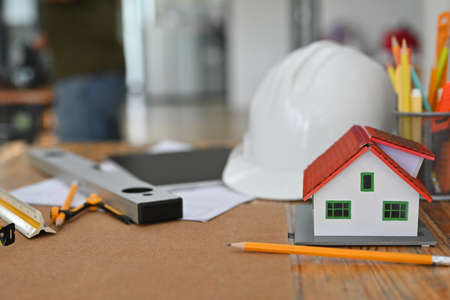 Photo of the wooden table surrounded by architecture equipment.の写真素材