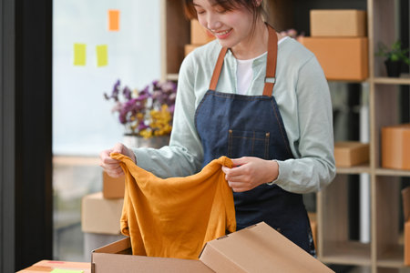 Close up with business owner packing online order to delivery, Freelance woman seller prepare parcel...