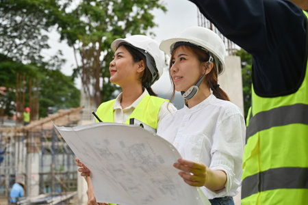 Engineering consulting team with foreman on construction site, Building inspector working on...