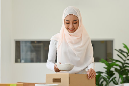 SME entrepreneur, Small business owner, Online selling concept with Happy Young Muslim woman with...