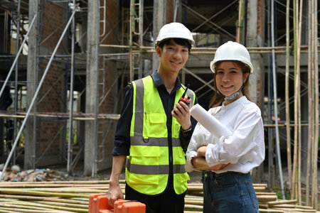 Portrait of professional two Engineer workers looking at the camera to take with confidence and a...