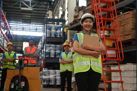 Group portrait of diverse industrial workers at distribution warehouse, Industrial people and manufacturing labor concept.の写真素材