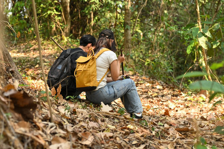 Young LGBT teenage couple relaxing while hiking.の写真素材