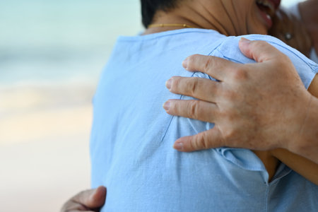 Close-up image of An Elderly couple hugging each other happily, Relax and enjoy at the seaside...