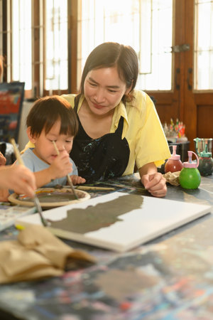 Parent and child share a bonding moment while exploring colors and creativity in an early childhood...