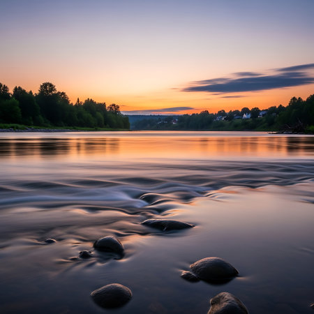 Sunset over the river. Beautiful summer landscape. Long exposure.