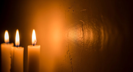 Burning candles on a dark background. Shallow depth of field.の写真素材