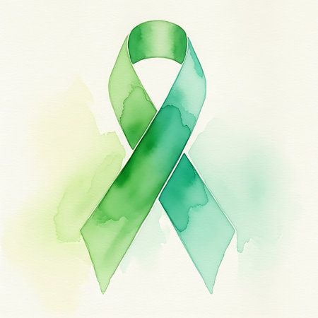 a watercolor illustration of a green ribbon symbolizing support and awareness on a white backgroundの写真素材